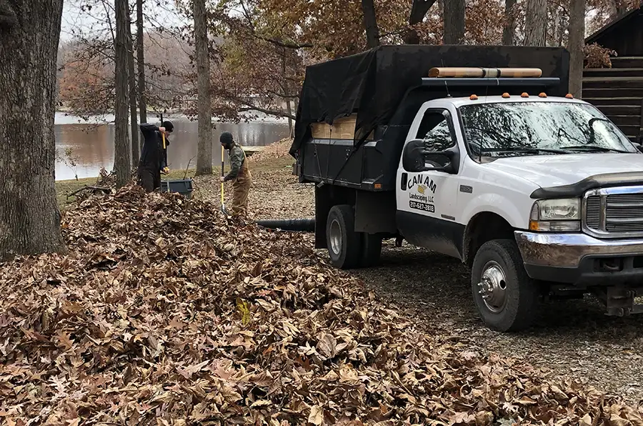 CanAm Professional Landscaping - fall cleanup crew at work, removing leaves and debris before winter hits - Girard, IL