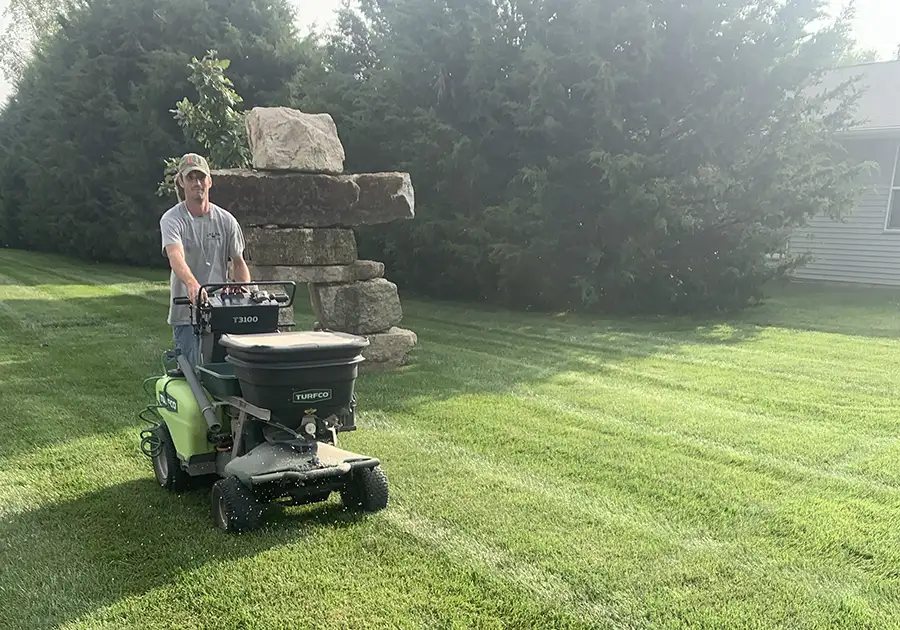CanAm Professional Landscaping - lawn maintenance, lawn care - spreading grass fertilizer - Girard, IL