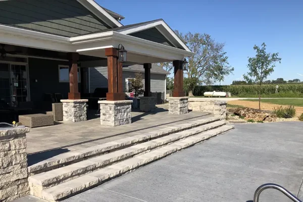 CanAm Professional Landscaping - landscaping project for back patio, stone steps, swimming pool, permanent gazeebo/awning - Girard, IL